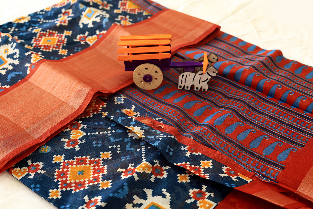 Teal Blue Silk Cotton Saree with Orange Border, Silver Zari, Graph Pattern, and Square Butta Blouse