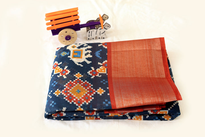 Teal Blue Silk Cotton Saree with Orange Border, Silver Zari, Graph Pattern, and Square Butta Blouse