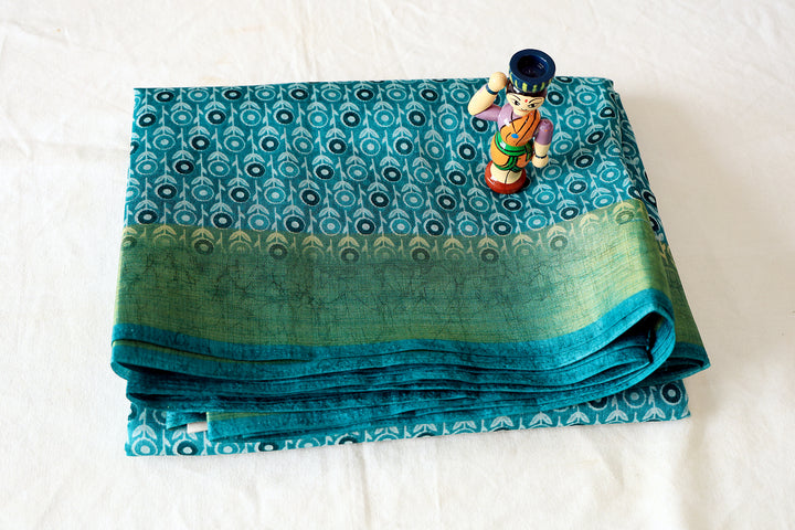 Aqua Cotton Fancy Saree With Gold Zari Border, Sunflower Motifs And Plain Blouse