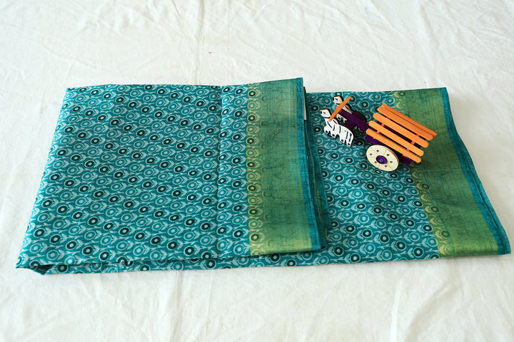 Aqua Cotton Fancy Saree With Gold Zari Border, Sunflower Motifs And Plain Blouse