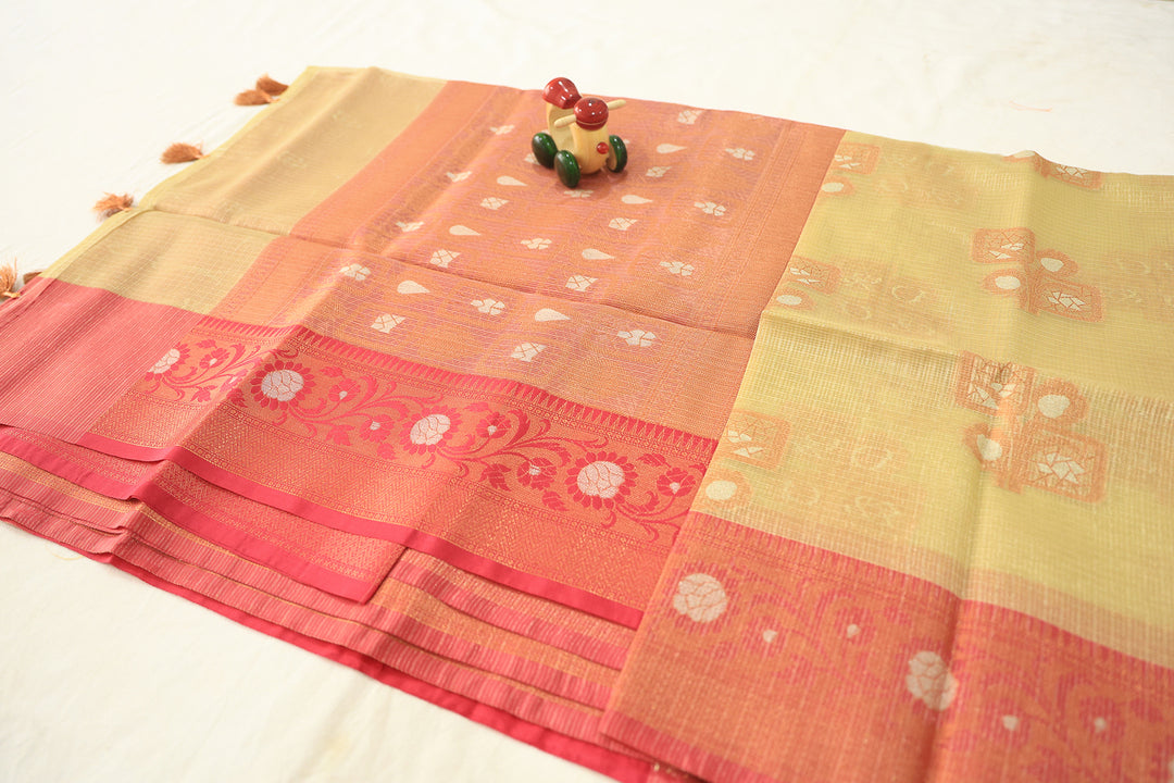 Sandal Glow Tissue Silk Saree With Pink Border And Copper-Silver Zari Floral Embellishments