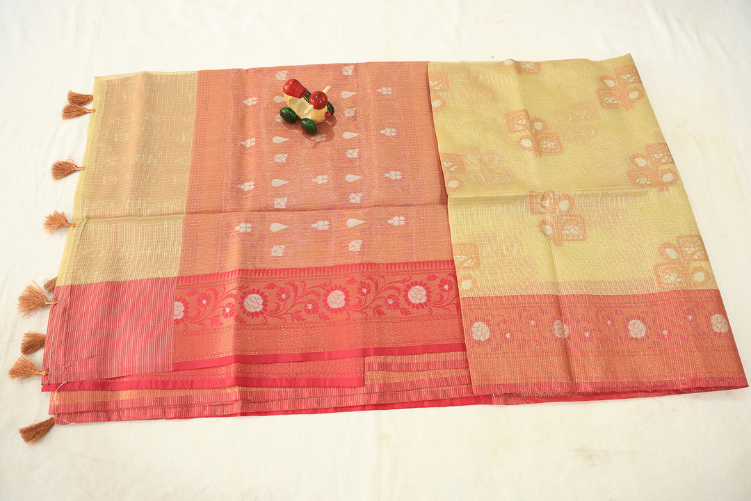 Sandal Glow Tissue Silk Saree With Pink Border And Copper-Silver Zari Floral Embellishments