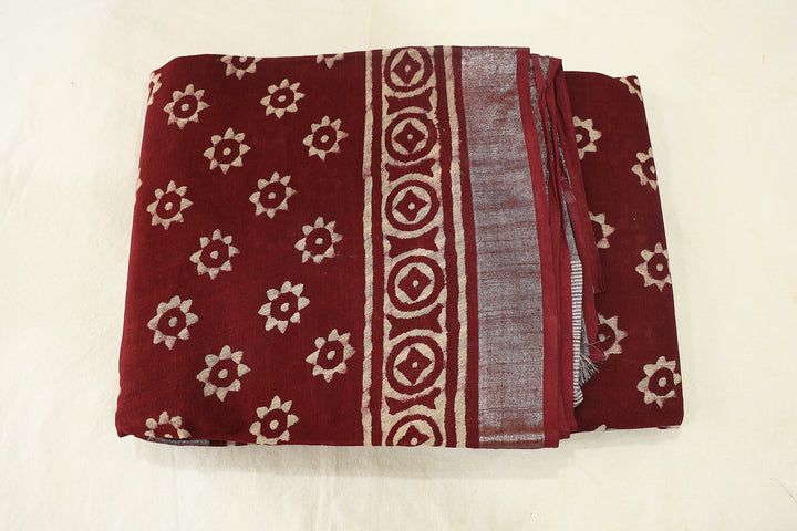 Burgundy Blossom Maroon Cotton Saree With Elegant White Florals And Silver Zari Embellishments