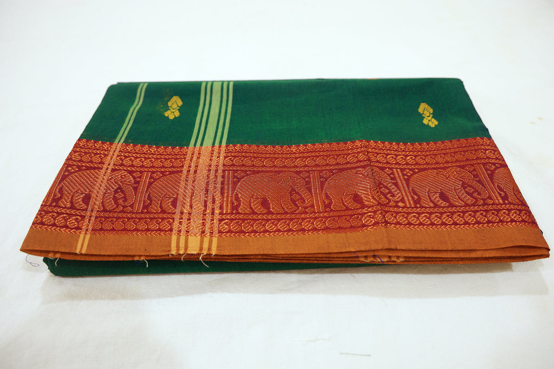 Dark Green Saree With Amber Border, Intricate Elephant Zari Designs And Scattered Flower Buttas