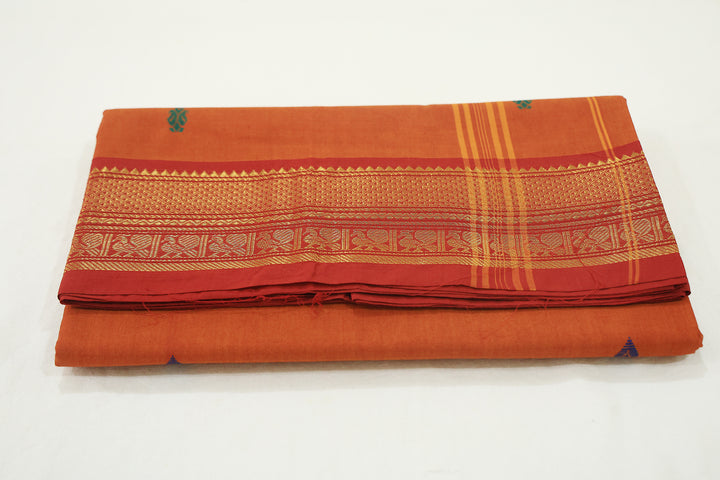 Rusty Orange Saree With Red Border, Peacock Zari Embellishments And Floral Whispers