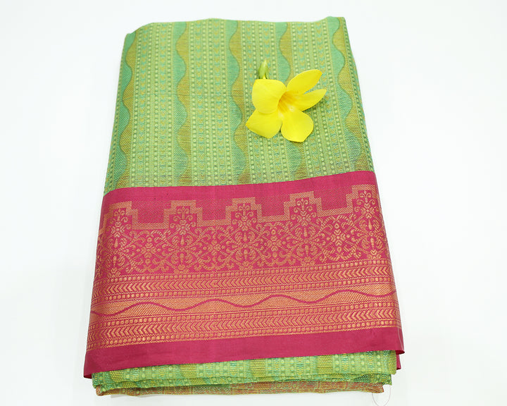 Parrot Green Dupion Silk Saree With Rani Pink Border And Gold Zari Leaf Design, Adorned With Wavy Stripe Patterns