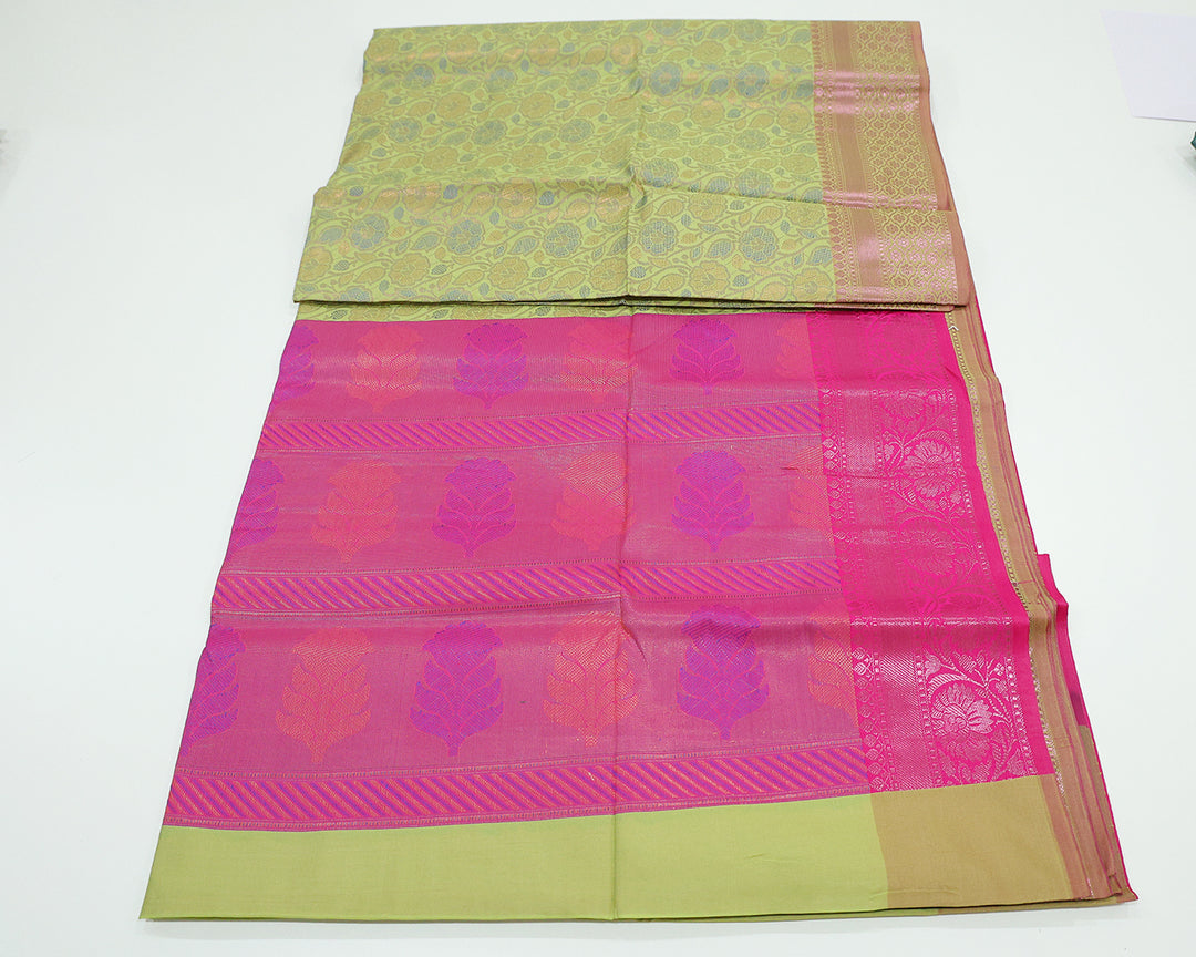 Pista Green Saree With Pink Zari Border And Pallu, Adorned With Floral Design And Patterned Blouse