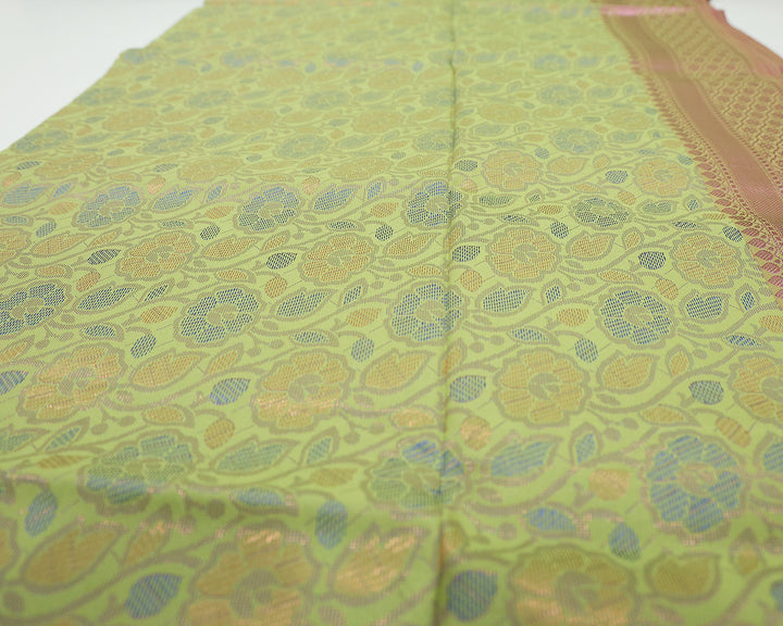 Pista Green Saree With Pink Zari Border And Pallu, Adorned With Floral Design And Patterned Blouse