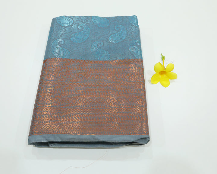 Blue Saree With Blue Zari Mango Designs, Copper Zari Border, And Checked Square Pattern Blouse