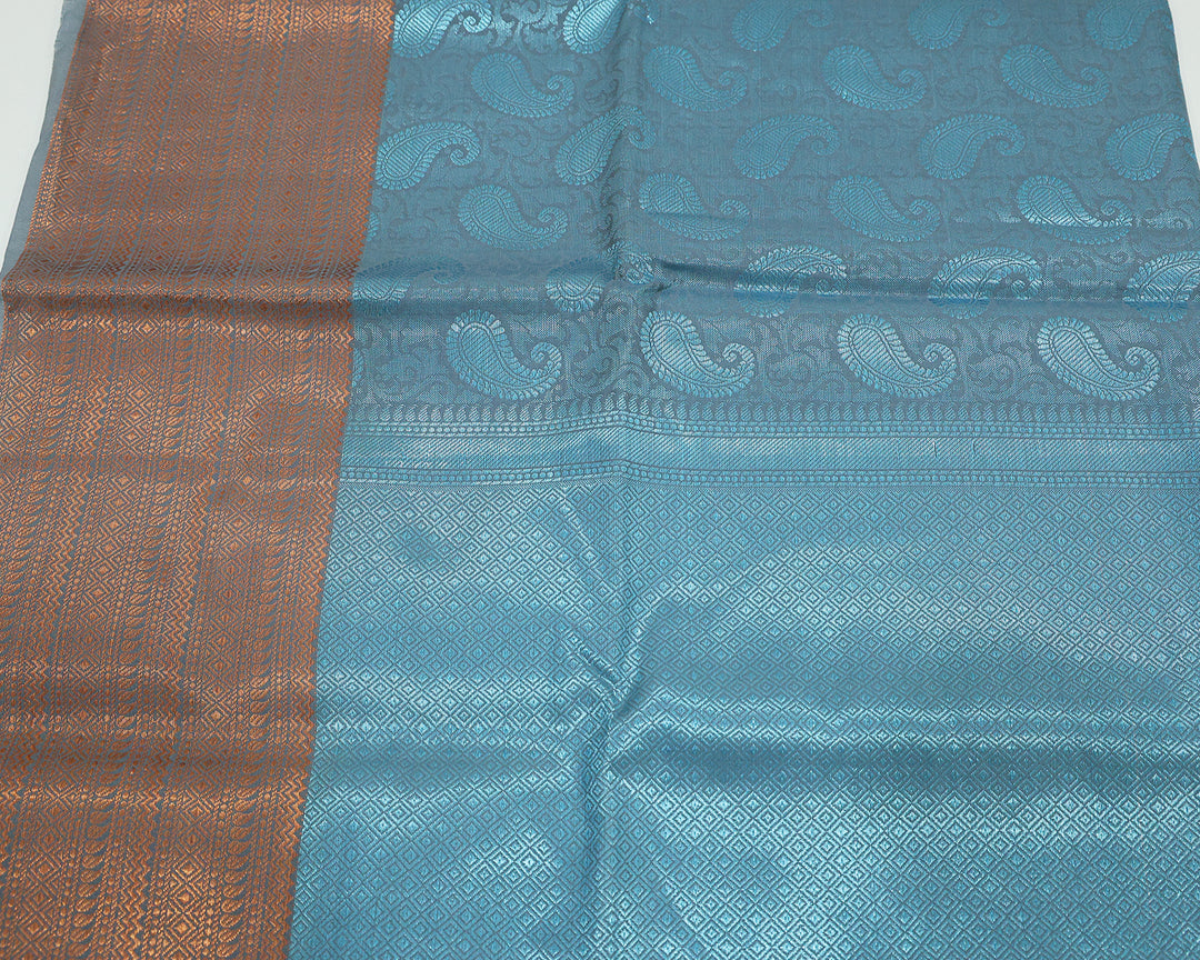 Blue Saree With Blue Zari Mango Designs, Copper Zari Border, And Checked Square Pattern Blouse