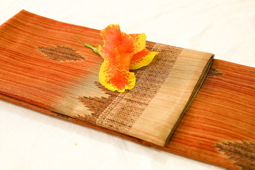 Silk Cotton Saree in Orange with Sandal Temple Border and Intricate Temple Butta Design.