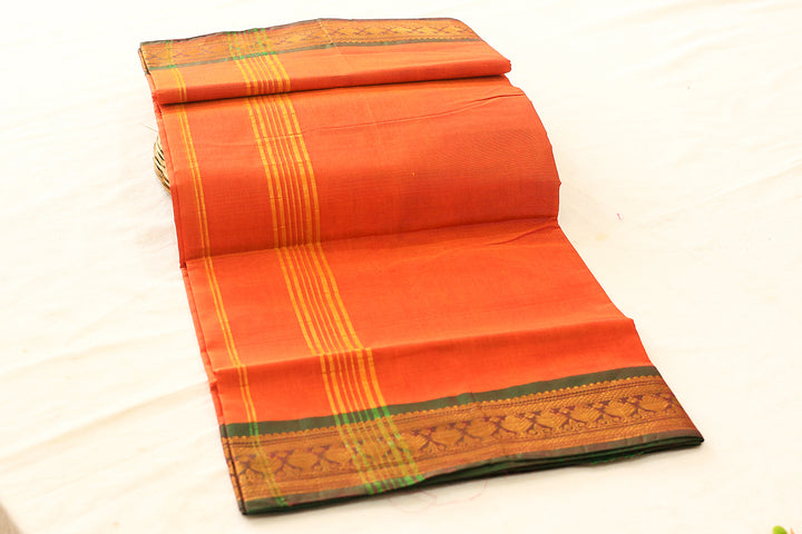 Orange Cotton Saree with Green Gold Zari Border and Floral Buttas