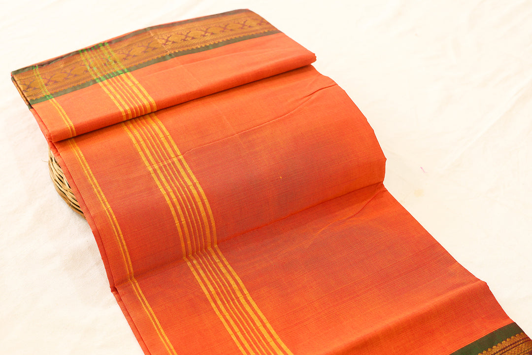 Orange Cotton Saree with Green Gold Zari Border and Floral Buttas