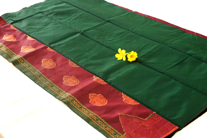 Burgundy Silk Cotton Saree with Dark Green Floral Buttas and Border