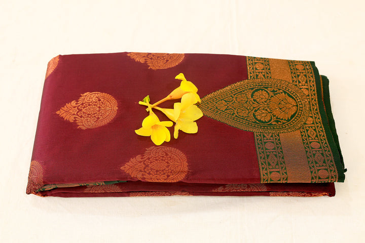 Burgundy Silk Cotton Saree with Dark Green Floral Buttas and Border