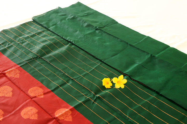 Maroon Silk Cotton Saree with Green Copper Zari Border, Floral Buttas, and Contrast Pallu