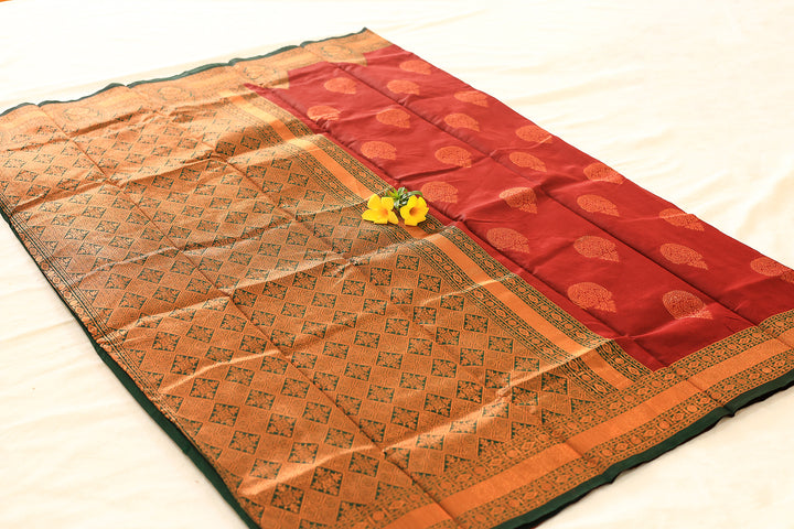 Maroon Silk Cotton Saree with Green Copper Zari Border, Floral Buttas, and Contrast Pallu