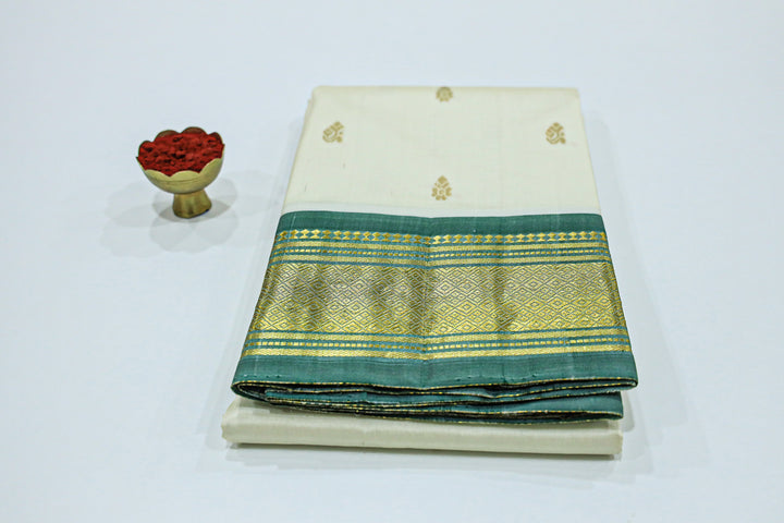 Kanchipuram Pure Silk Saree With Contrast Border, Gold Zari Accents And Tassels