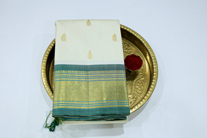 Kanchipuram Pure Silk Saree With Contrast Border, Gold Zari Accents And Tassels